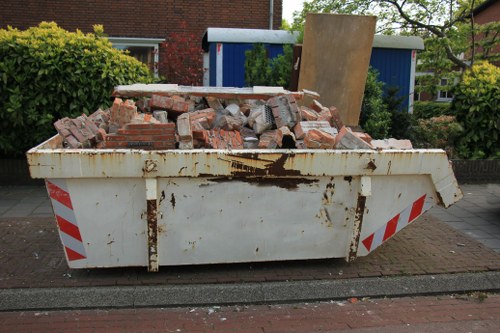 Homeowners arranging furniture for clearance in Charlton